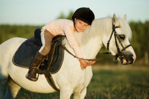 girl-riding-a-horse-000043963532_large